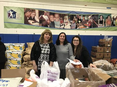 Photo of employees volunteering for East End House Thanksgiving Food Drive.